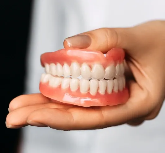 Dentures Howell – patient with natural-looking custom dentures at Riverpark Dental of Howell