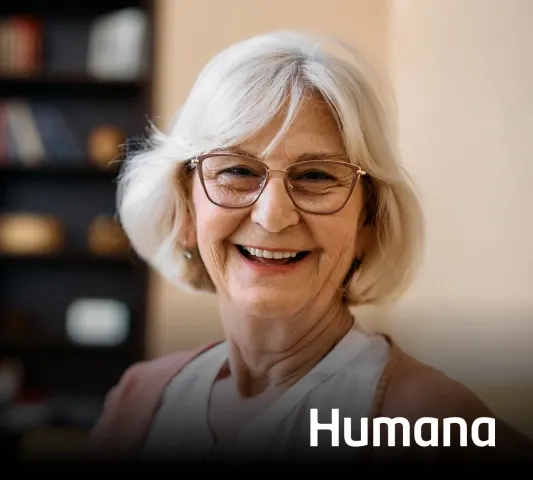 Humana Dentist Howell – older adult patient discussing dentures with a dentist at Riverpark Dental of Howell