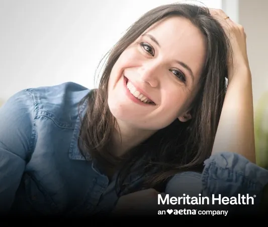 Meritain Dentist Howell – insurance coordinator reviewing a patient's dental benefits at Riverpark Dental of Howell